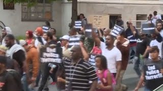 Caught on tape: Baltimore officer hugs young protester