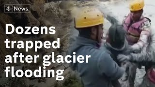 Race to reach trapped workers after Himalyan glacier causes flooding in India