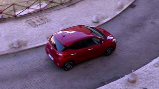 The new Hyundai i10 in Dragon Red Driving in the city