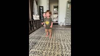 Boy does roundhouse karate kicks and accidentally hits little brother on top of head