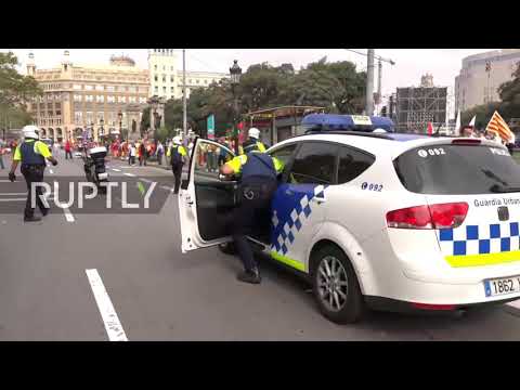 Spain: Chairs sent flying as protesters clash on national holiday in Barcelona