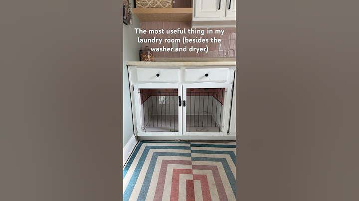 Cabinet turned dog kennel DIY. I used panels from a HomeGoods gate for doors #diy #dogkennel