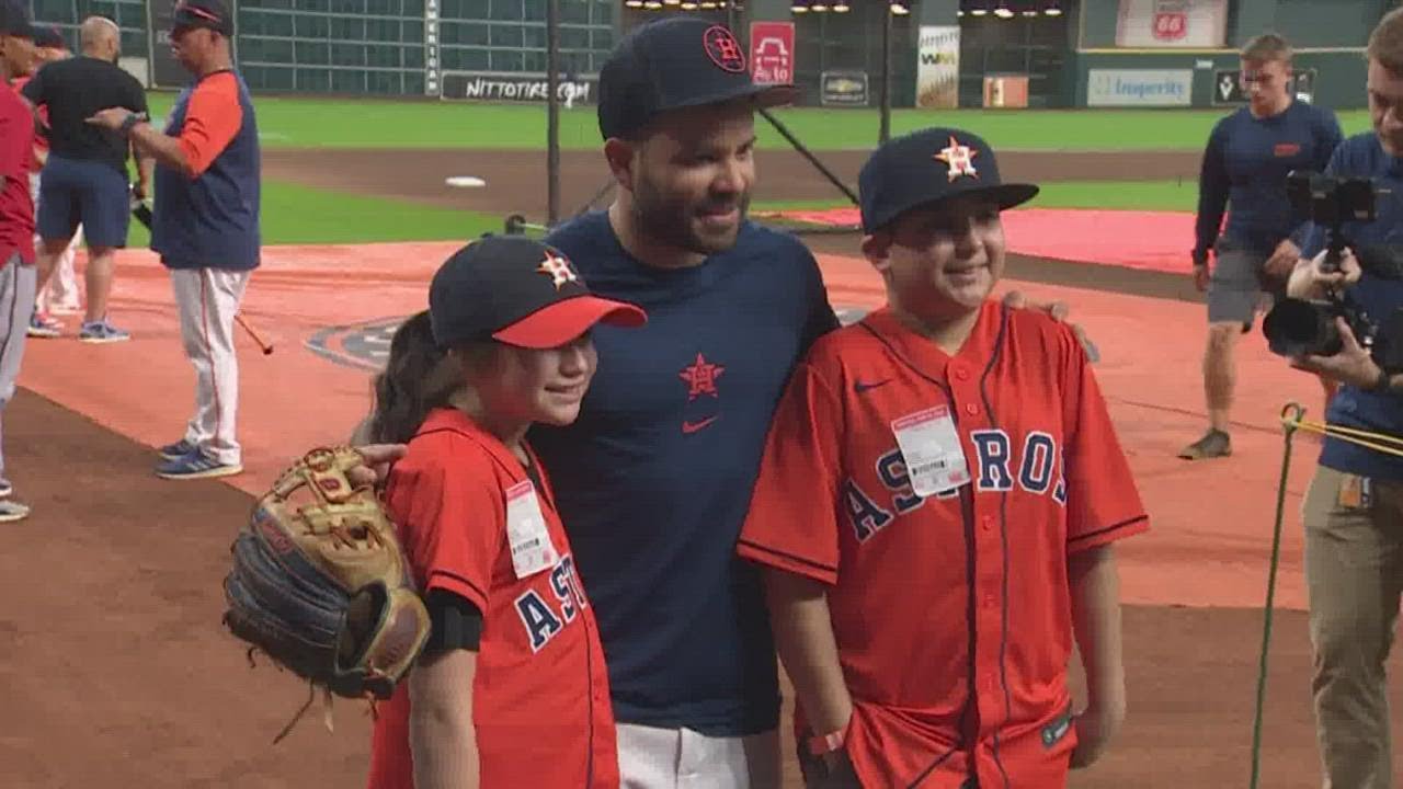 Minnesota Twins' Carlos Correa and Daniella Correa await the