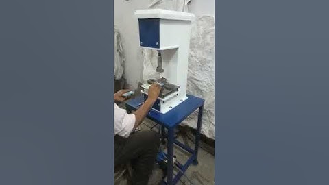 Tag punching machine