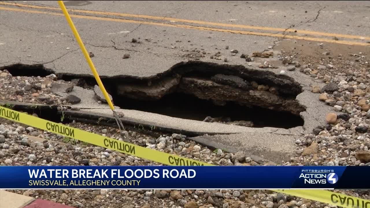 Water main break floods Swissvale road - YouTube
