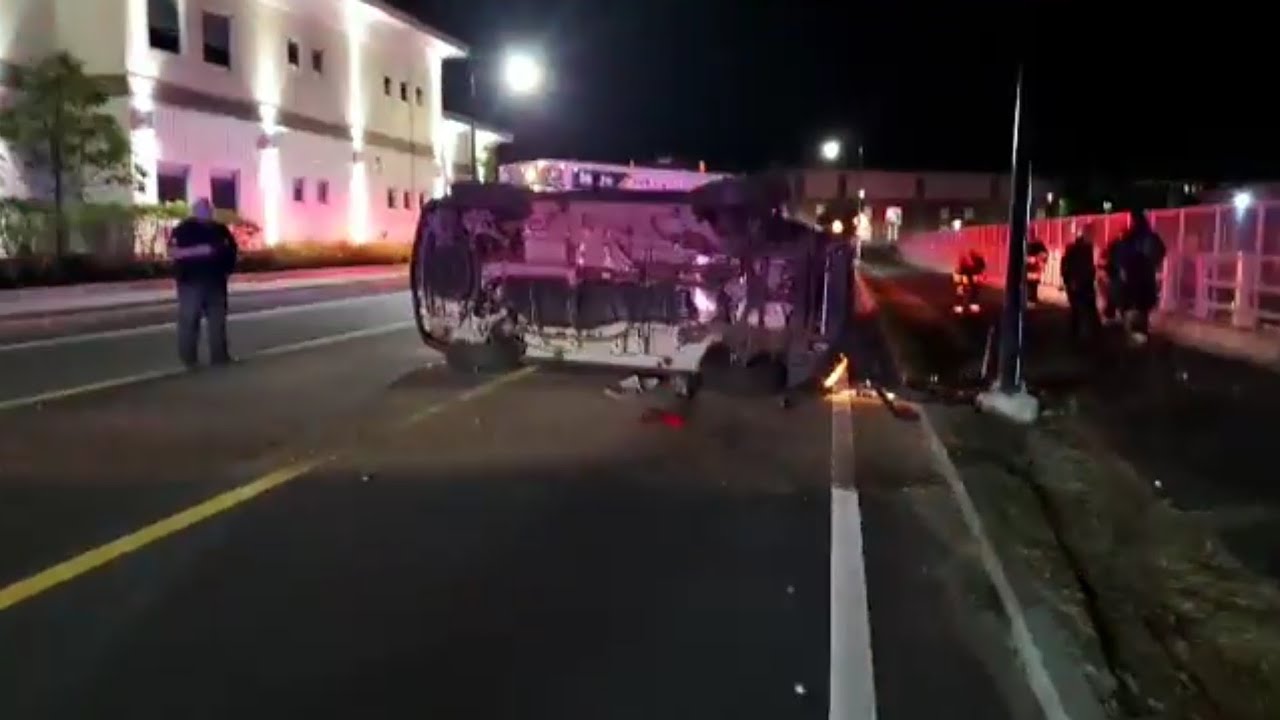 WOMAN FLIPS CAR ON SIDE AFTER CRASHING INTO POLE - YouTube