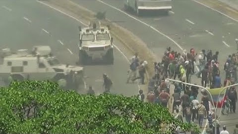 Venezuela National Guard runs over protesters amid call for military uprising