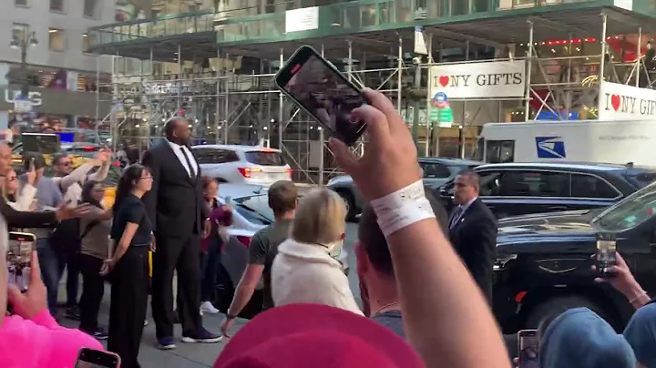 Arnold Schwarzenegger escorted into an event in NYC by his MASSIVE Security Guard!
