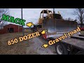 Mack truck hauling John Deere 850B LT bulldozer