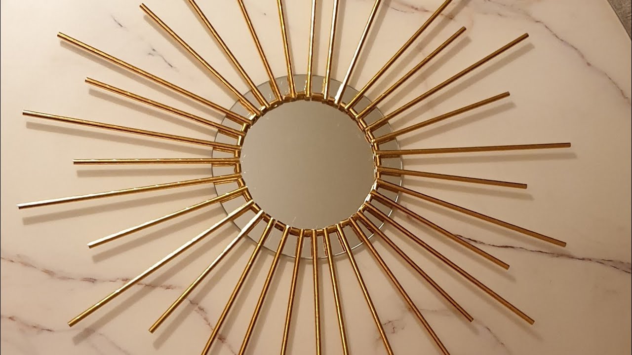DIY sunburst mirror with paper straws.