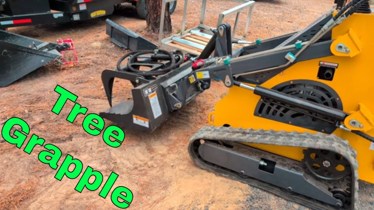 First Try with the Stump Grapple on the Mini Skid Steer - YouTube