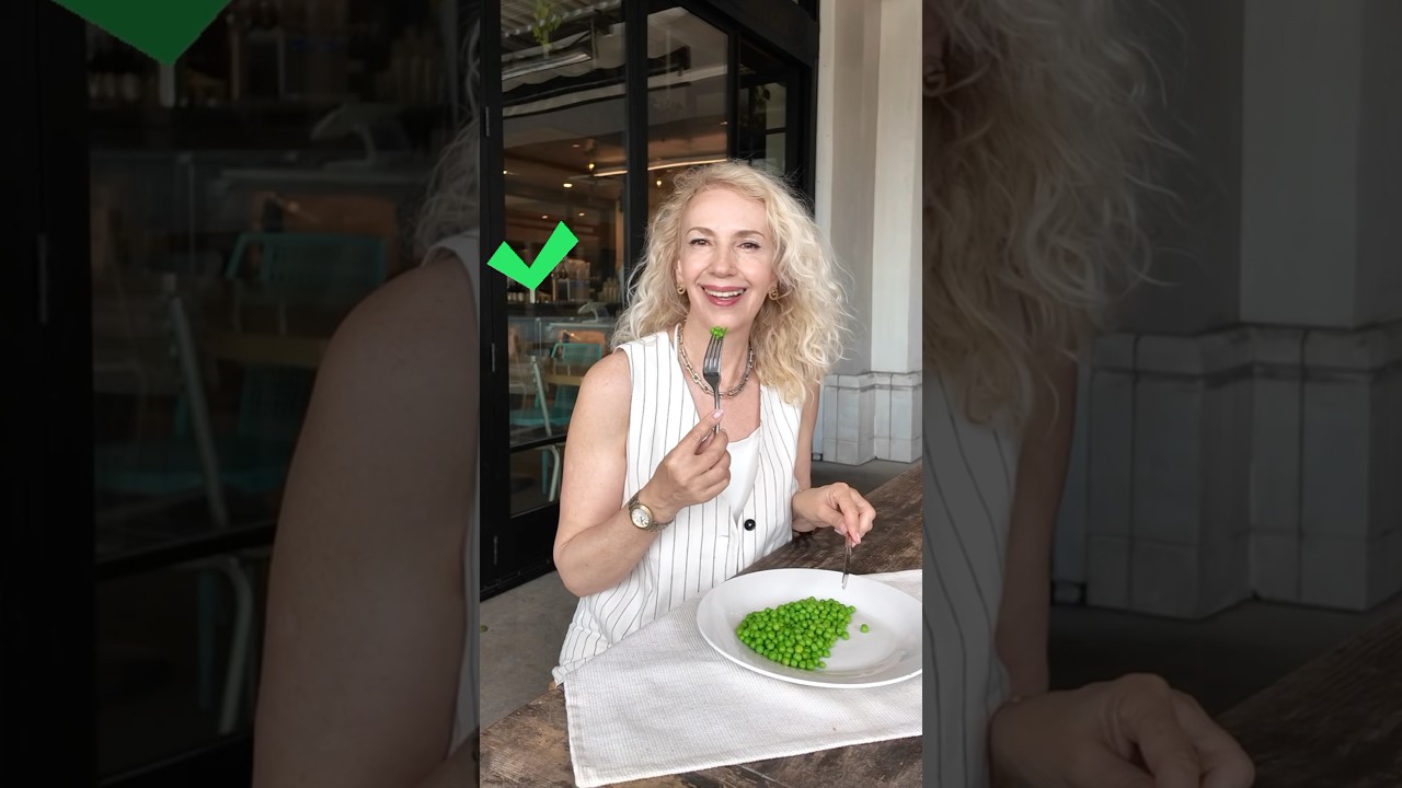 How to eat peas elegantly. Using your knife push and spear few peas onto the tines of your fork.