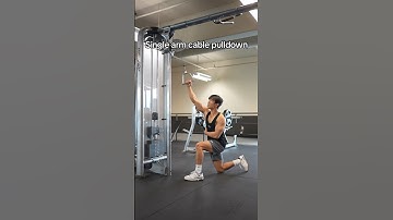 Which leg should be in front on a Kneeling Single Arm Cable Pulldown?