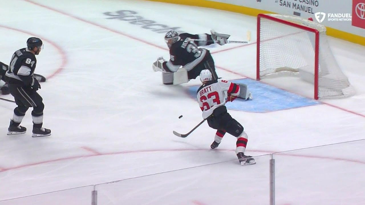 Darcy Kuemper makes a pad save on a bouncing puck.