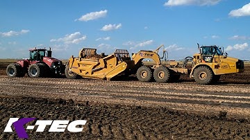 Case Tractor Pushing ADT to Load 63 Cubic Yard Scraper