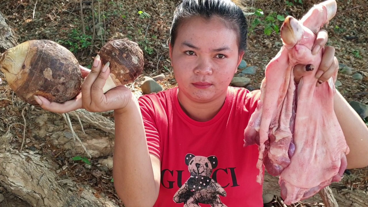 Yummy cook pig leg and taro -  eating  delicious