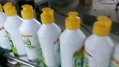 Fully automated high speed spindle capping machine for liquid detergent bottles