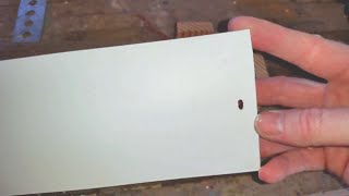 Cutting vertical blinds and jig for cutting hanging slots.