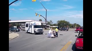 AAA Hoosier Motor Club Technician helps lady and child across busy intersection - Carmel IN