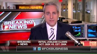Weekly jobless claims fall to 262,000