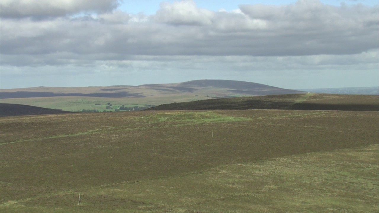 Aerial view tracking over Hamel Down, Dartmoor National Park, Devon, England, UK