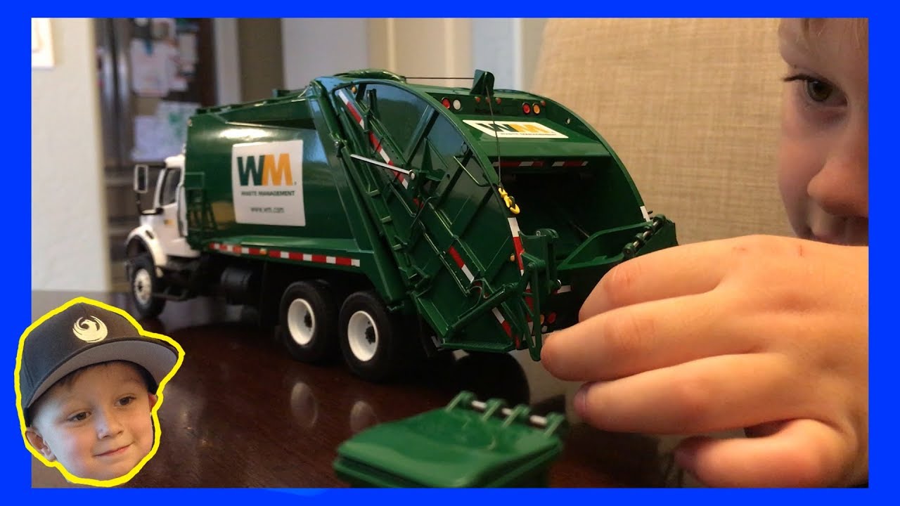 toy garbage truck with compactor