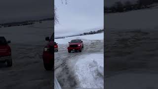 Driving Truck on Frozen Lake Minnetonka, Minnesota for Ice Fishing