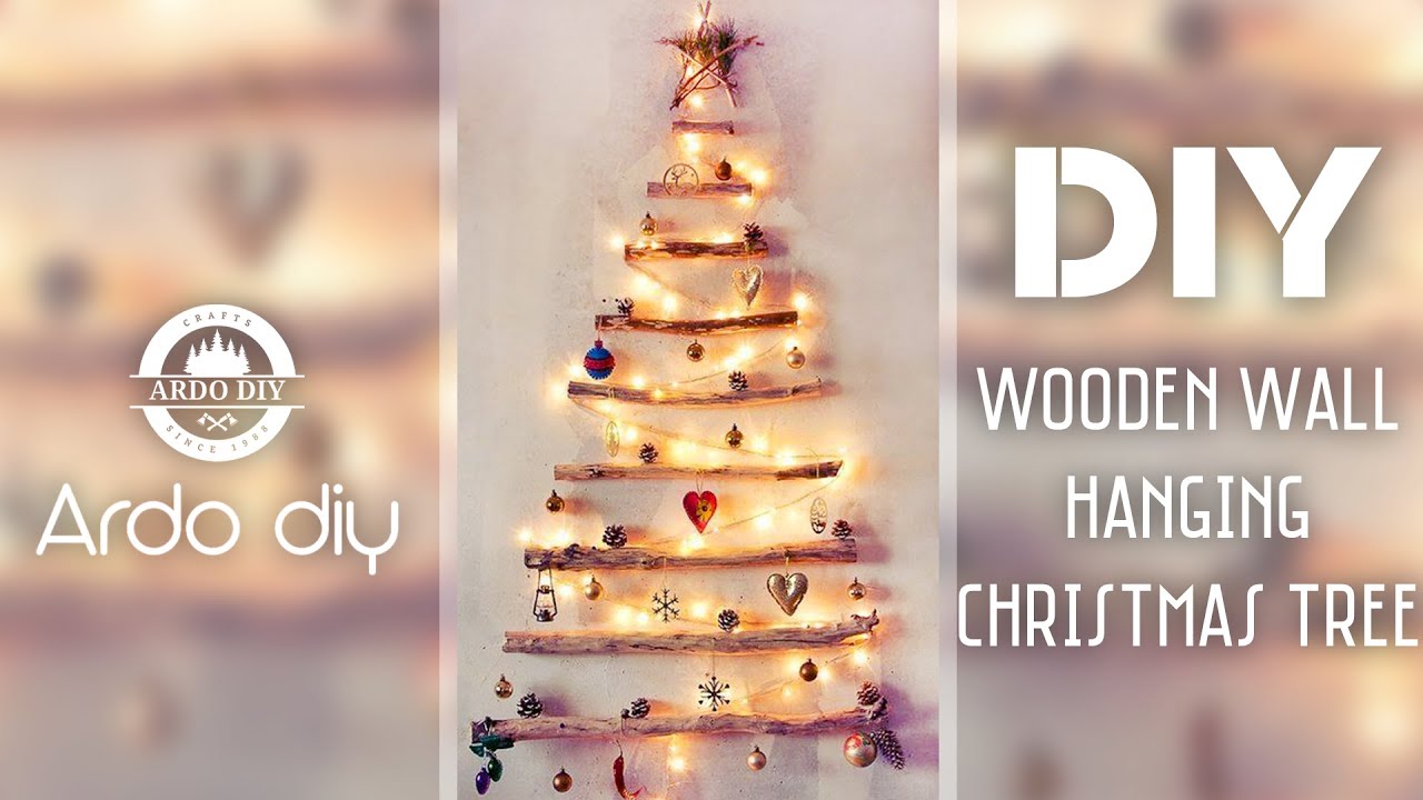 DIY wooden wall hanging Christmas tree. New Year Beautiful Decoration