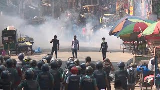 Bangladesh garment workers clash with police in violent protest | AFP