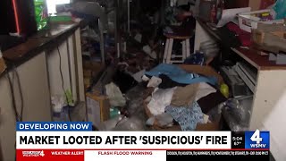 Market looted after 'suspicious' fire
