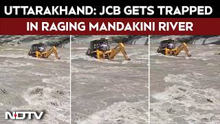 उत्तराखंड समाचार | भारी बारिश के बीच मंदाकिनी नदी में फंसी जेसीबी, 2 लोगों को बचाया गया screenshot 1
