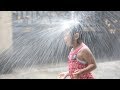 Kids Happily Playing Ball in Rainy Day