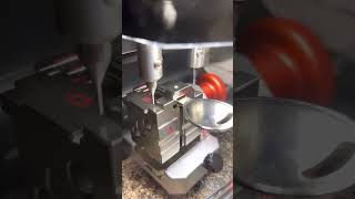 Black Widow key cutting machine.  Decoding key by picture then cutting it on the machine.
