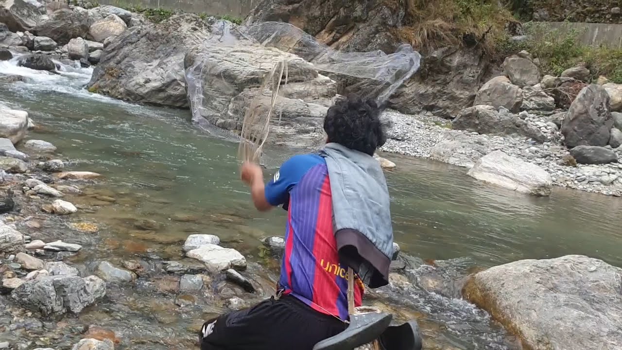 FRESHWATER FISHING WITH IN SMALL RIVER OF NEPAL HIMALAYAN