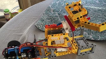 2 Servo motors with Superbit 2 wheel bot car. Raise and lower gripper, open and close gripper, drive