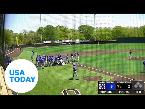 College baseball pitcher tackles player during game after home run hit | USA TODAY