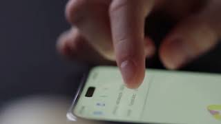 Close up shot of fingers scrolling through smartphone settings menu