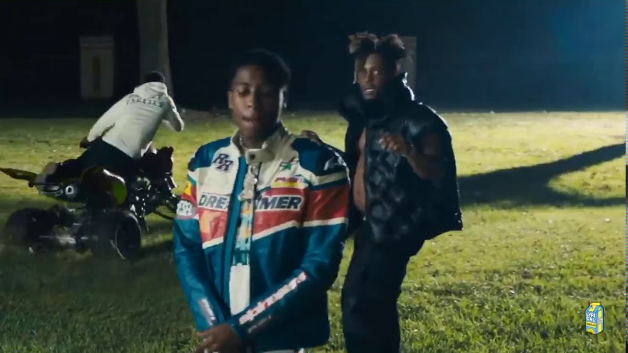 The grey Louis Vuitton monogram down jacket worn by Juice Wrld in his Bandit  feat music video. NBA Youngboy