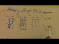 Understanding Addition with Grids and Vertical Alignment