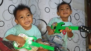 Singing While Playing The New Green Guitar | Favorite Musical Instrument Toy