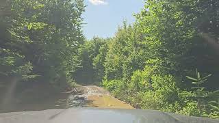 Driving Down Rough Atv Trail Full Of Mud