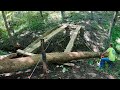 Bolting up Arched Log on Timber Bridge in the Woods - Good Progress