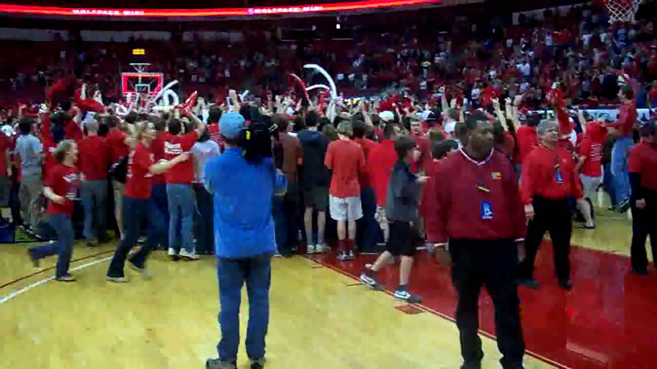 N.C. State fans rush the court