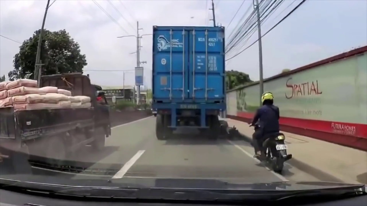 Lucky guy on motorbike gets his head run over by a big truck and ...