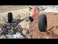 Man rolls tyres down hill in satisfying