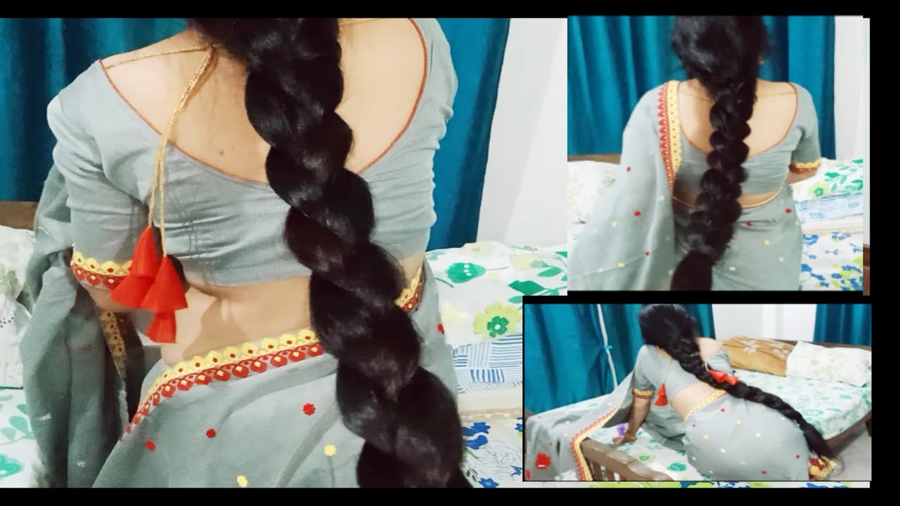 Very thick long hair braids style of Indian housewife