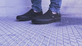 vans slip on all black on feet