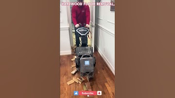 Rogue walk behind floor scraper in action,removing glue down hardwood floor