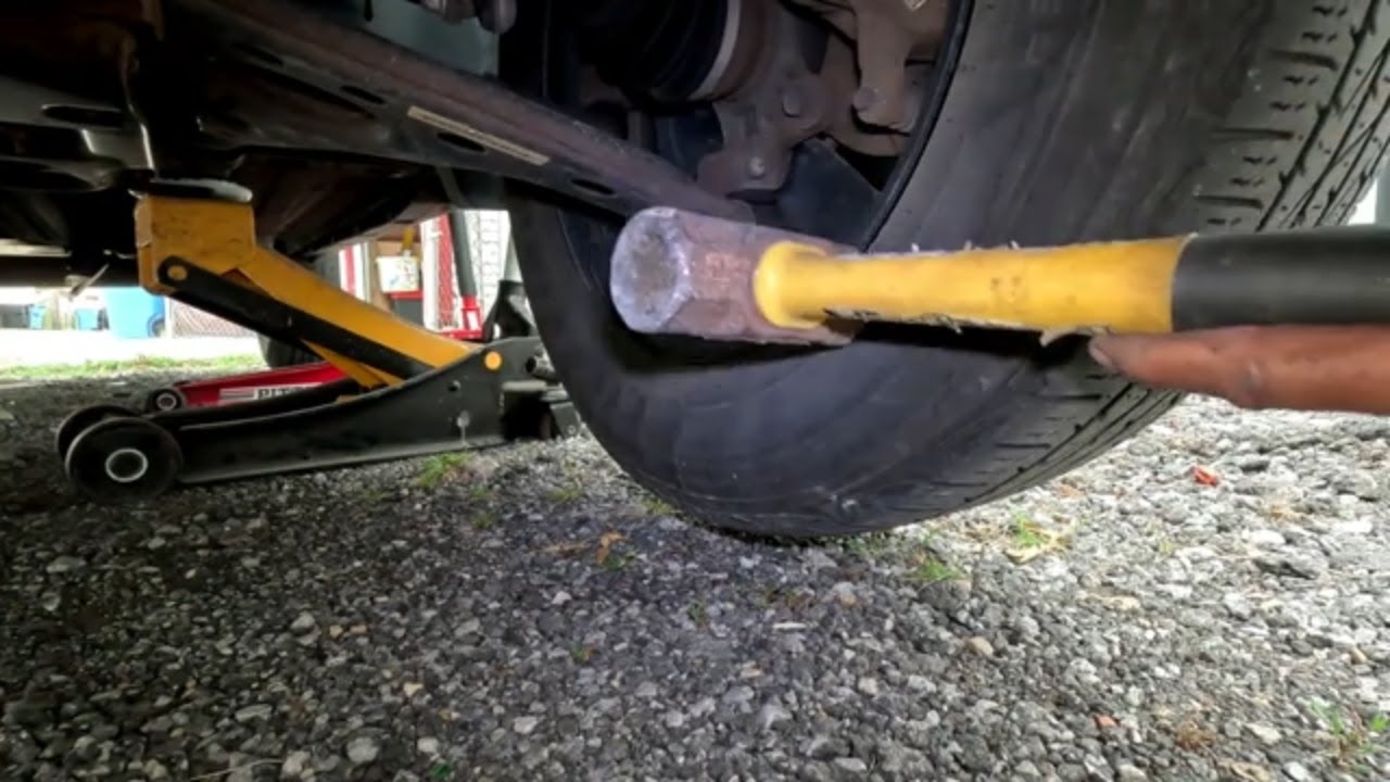 Removing a rim thats stuck on a car YouTube