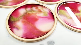 Beautiful pink and gold resin coasters on aluminum panels with Arteza mica powders